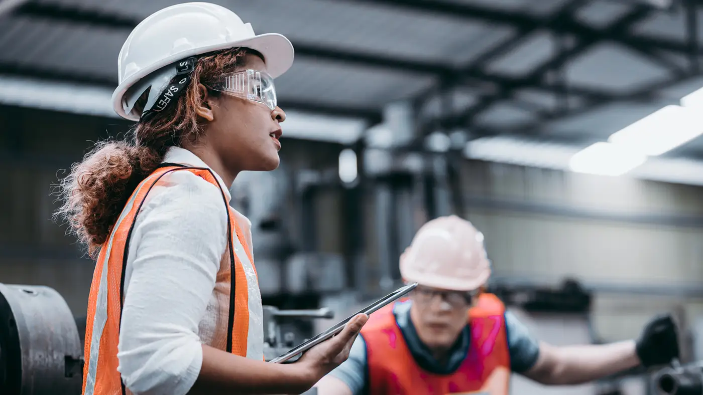Workers in high-visibility gear on a job site
