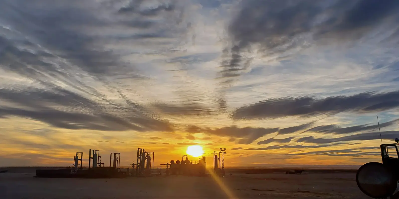 West Texas drilling location at sunset